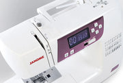 Janome 2030DC-G computerized sewing machine in grapevine purple front profile view showing the control dashboard.