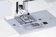 Janome 2030DC-G computerized sewing machine in grapevine purple front profile view showing the control dashboard.