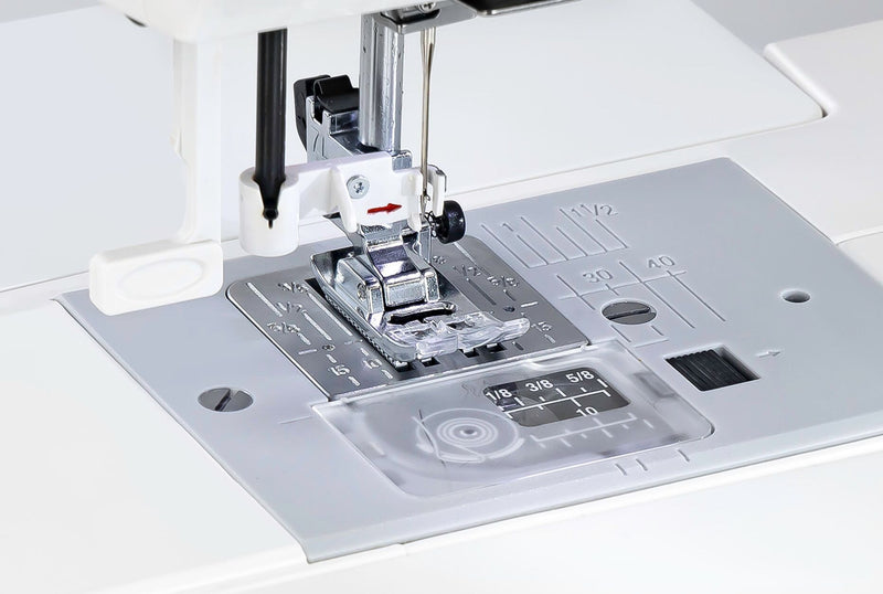 Janome 2030DC-G computerized sewing machine in grapevine purple front profile view showing the control dashboard.