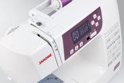 Janome 3160QDC-G computerized sewing and quilting machine in grapevine purple front view displaying the navigation layout.