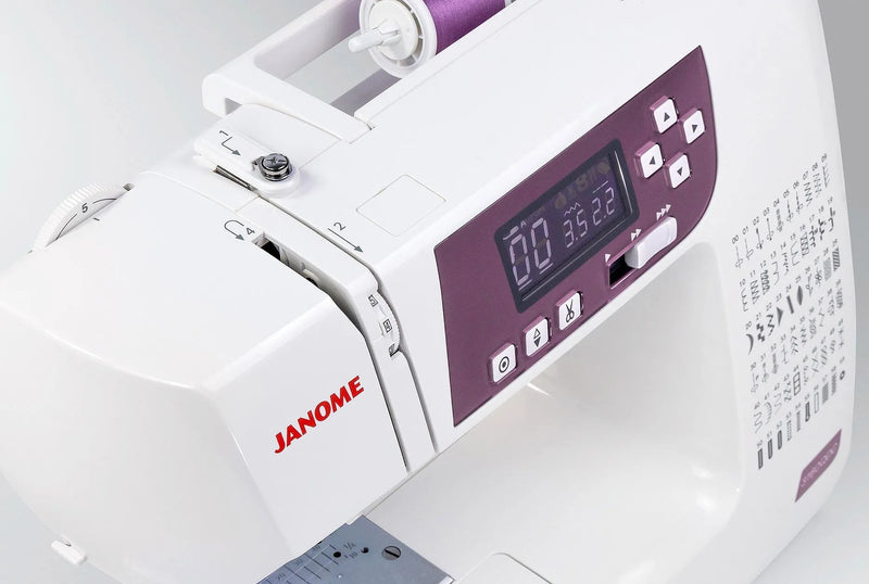 Janome 3160QDC-G computerized sewing and quilting machine in grapevine purple front view displaying the navigation layout.