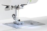 Janome 3160QDC-G computerized sewing and quilting machine in grapevine purple front view displaying the navigation layout.