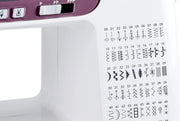 Janome 3160QDC-G computerized sewing and quilting machine in grapevine purple front view displaying the navigation layout.