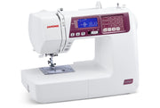 Janome 4120QDC-G computerized sewing and quilting machine in grapevine purple front view displaying the stitch index chart
