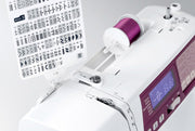 Janome 4120QDC-G computerized sewing and quilting machine in grapevine purple front view displaying the stitch index chart