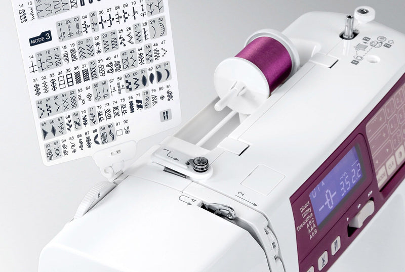 Janome 4120QDC-G computerized sewing and quilting machine in grapevine purple front view displaying the stitch index chart