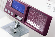 Janome 4120QDC-G computerized sewing and quilting machine in grapevine purple front view displaying the stitch index chart