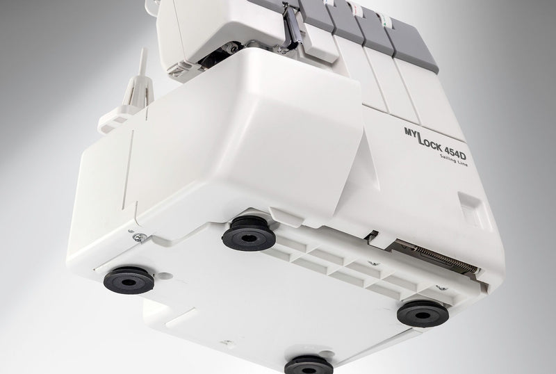 Janome MyLock 454D overlock serger front view showing the color-coded threading map and tension dials.