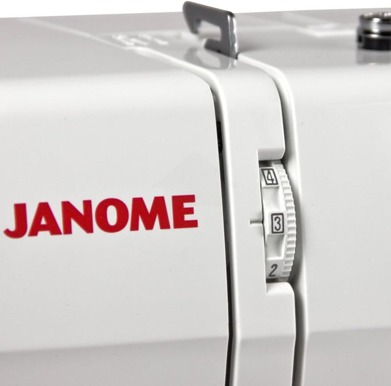 Janome 2212 mechanical sewing machine front view showcasing the stitch selection dial and clean white design.