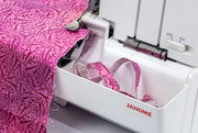 Janome MyLock 654D 4-thread overlock serger front view showcasing the color-coded threading guide and tension dials.