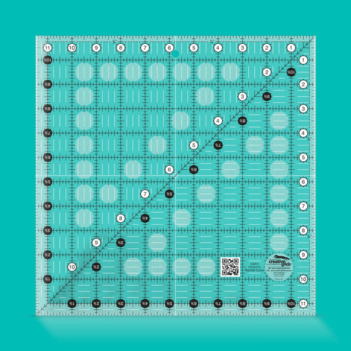 Creative Grids CGR11 eleven and a half inch square quilt ruler showing clear grid lines.