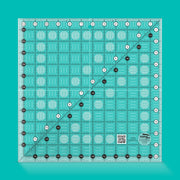 Creative Grids CGR12 twelve and a half inch square acrylic quilt ruler with black and white grid markings.