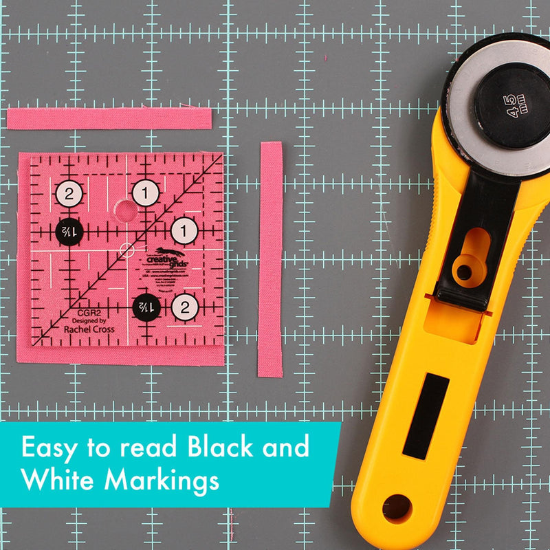 Creative Grids CGR2 two and a half inch square quilt ruler with non slip ring grips.