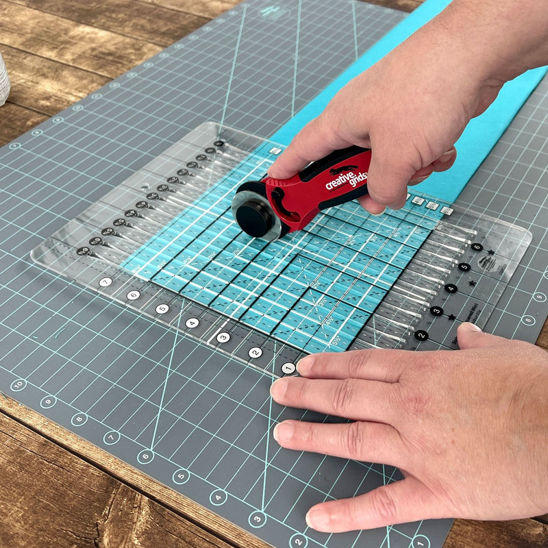 Creative Grids 18 inch by 24 inch double sided self healing rotary cutting mat CGRMAT1824 flat view.