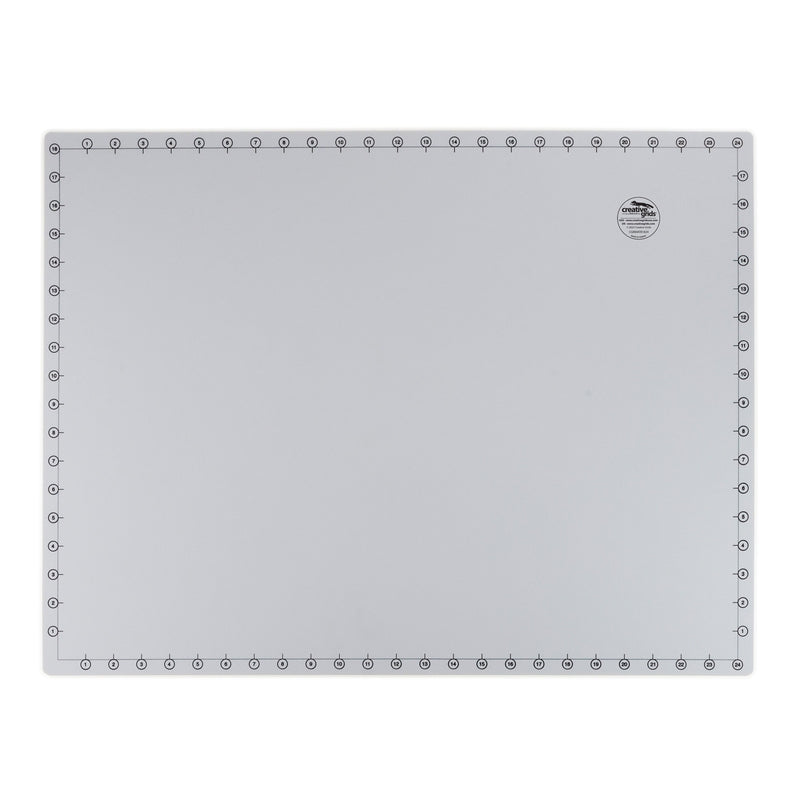 Creative Grids 18 inch by 24 inch grid free self healing rotary cutting mat CGRMATB1824 flat workspace view.
