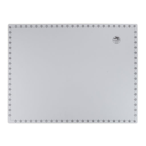 Creative Grids 18 inch by 24 inch grid free self healing rotary cutting mat CGRMATB1824 flat workspace view.