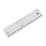 Creative Grids Quick Trim 3.5-inch by 12.5-inch rectangle quilting ruler laid flat over patterned fabric.