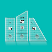 Creative Grids Scrap Crazy four-piece acrylic quilt template set displayed over multi-colored fabric scraps.
