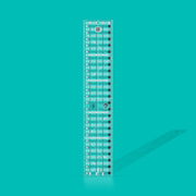 Creative Grids Quick Trim Two 4.5-inch by 24.5-inch long acrylic ruler laid across a folded bolt of fabric.