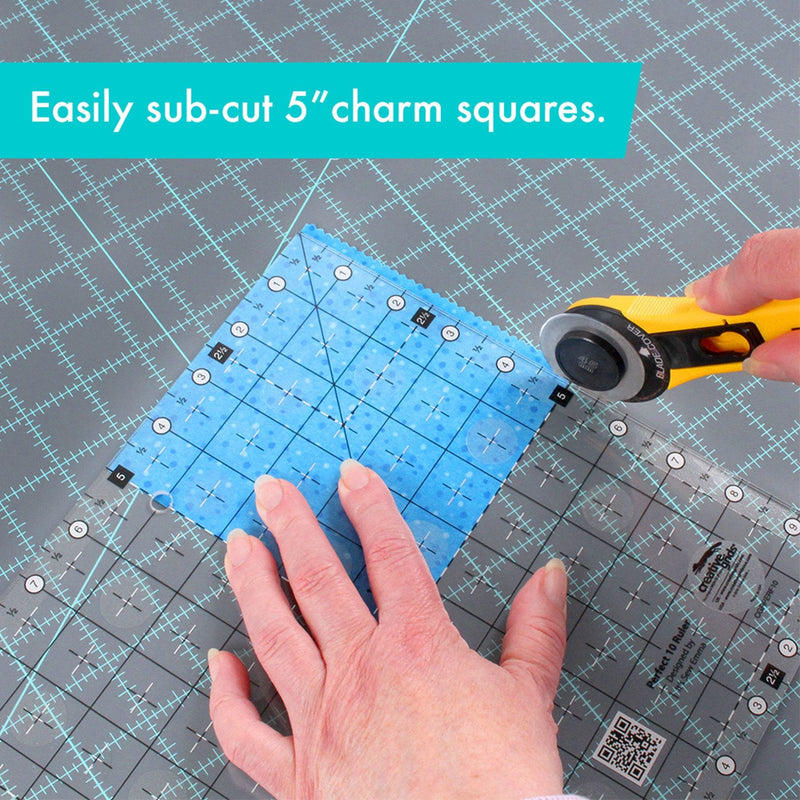 Creative Grids Perfect 10 square quilting ruler placed perfectly over a 10-inch fabric layer cake block.