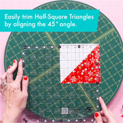 Creative Grids Perfect 10 square quilting ruler placed perfectly over a 10-inch fabric layer cake block.