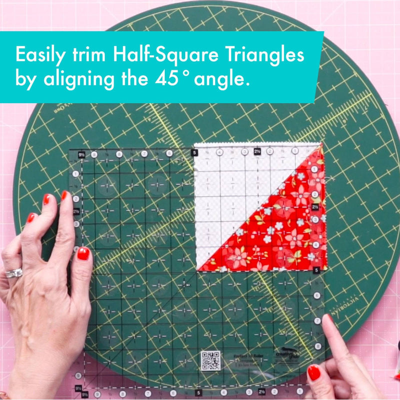 Creative Grids Perfect 10 square quilting ruler placed perfectly over a 10-inch fabric layer cake block.