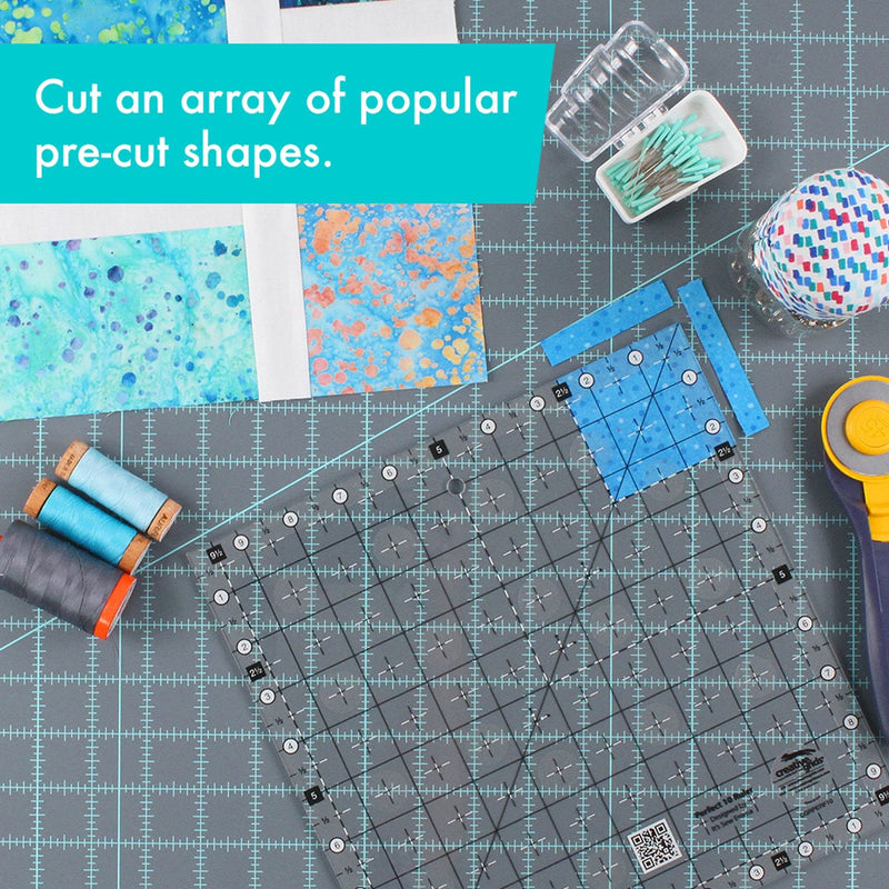 Creative Grids Perfect 10 square quilting ruler placed perfectly over a 10-inch fabric layer cake block.