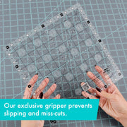 Creative Grids Perfect 10 square quilting ruler placed perfectly over a 10-inch fabric layer cake block.