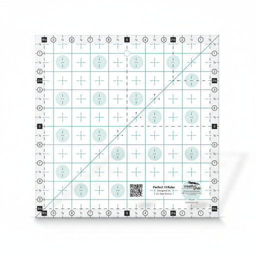 Creative Grids Perfect 10 square quilting ruler placed perfectly over a 10-inch fabric layer cake block.