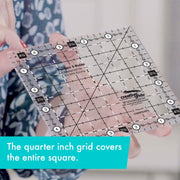 Creative Grids Perfect 5 square quilting ruler placed directly over a 5-inch fabric charm pack square.