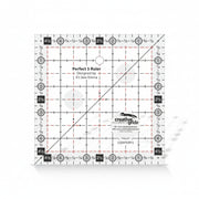 Creative Grids Perfect 5 square quilting ruler placed directly over a 5-inch fabric charm pack square.