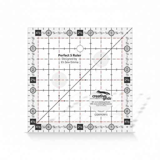 Creative Grids Perfect 5 square quilting ruler placed directly over a 5-inch fabric charm pack square.