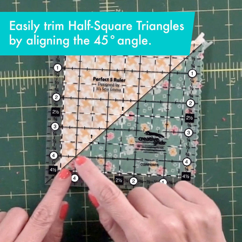 Creative Grids Perfect 5 square quilting ruler placed directly over a 5-inch fabric charm pack square.