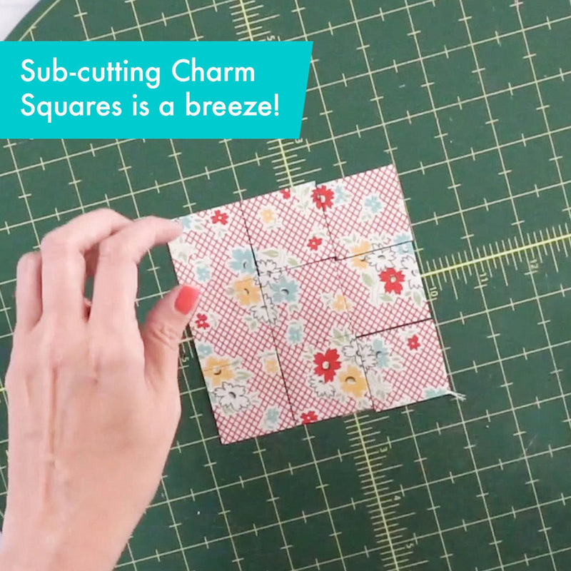 Creative Grids Perfect 5 square quilting ruler placed directly over a 5-inch fabric charm pack square.