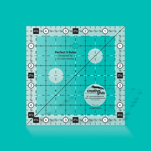 Creative Grids Perfect 5 square quilting ruler placed directly over a 5-inch fabric charm pack square.