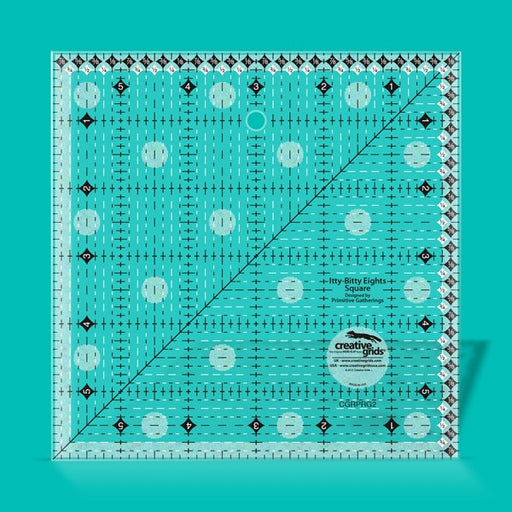 Creative Grids Itty-Bitty Eights 6-inch by 6-inch square quilting ruler sitting over a geometric patchwork block center.