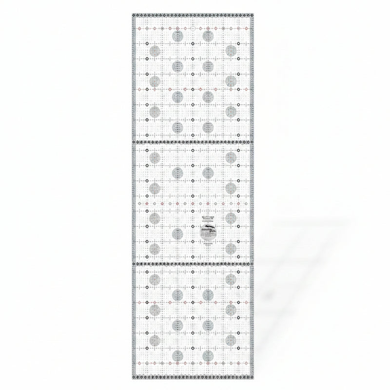 Creative Grids Itty-Bitty Eights XL 8-inch by 24-inch rectangle quilting ruler positioned over a wide fabric yardage fold.