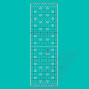 Creative Grids Itty-Bitty Eights XL 8-inch by 24-inch rectangle quilting ruler positioned over a wide fabric yardage fold.