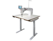 Janome Quilt Maker Pro 20 Versa ST sit-down longarm mounted into the sturdy manually adjustable Regulated Table.