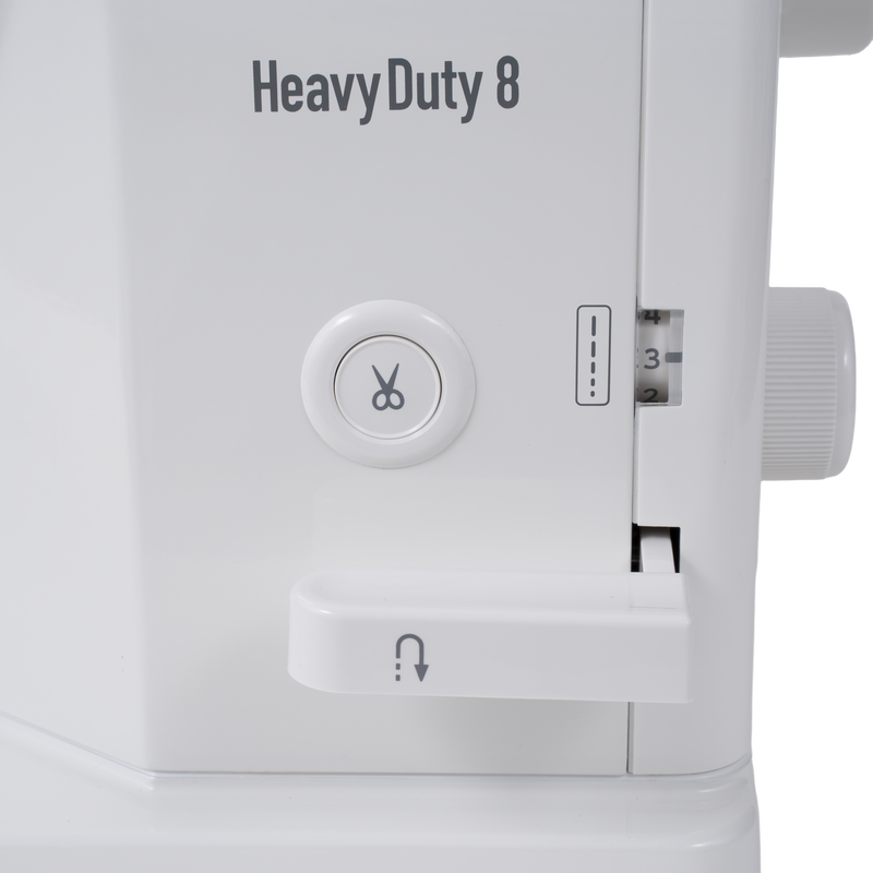 Janome reference photo: HD8 Heavy Duty 8 badge and thread cutter button