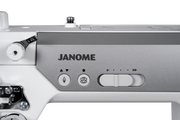 Janome reference photo: HD9QC Professional needle up/down and thread cutter buttons with speed control slider