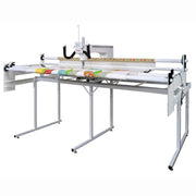 Janome Quilt Maker 18 longarm quilting machine head highlighting the ergonomic handles and LCD touchscreen display.