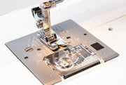 Janome Sewist 721 mechanical sewing machine front view showcasing the stitch selection dial and tension controls.
