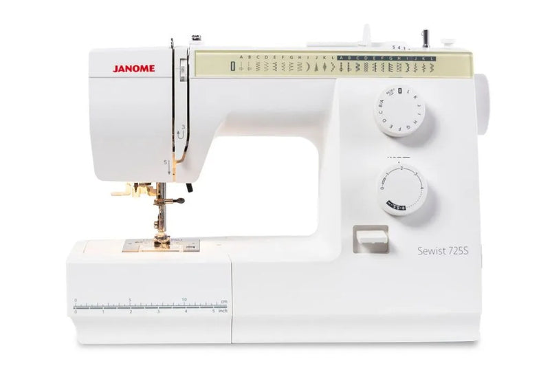 Janome Sewist 725 mechanical sewing machine front view showcasing stitch pattern selection dials and layout lines.