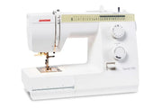 Janome Sewist 725 mechanical sewing machine front view showcasing stitch pattern selection dials and layout lines.