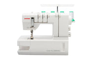 Janome 2000CPX cover hem sewing machine front view showing the color reference chart and extra-long bed