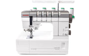 Janome CoverPro 3000P professional cover hem machine front view showing the extra long bed and thread cones.