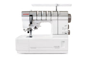 Janome CoverPro 3000P professional cover hem machine front view showing the extra long bed and thread cones.