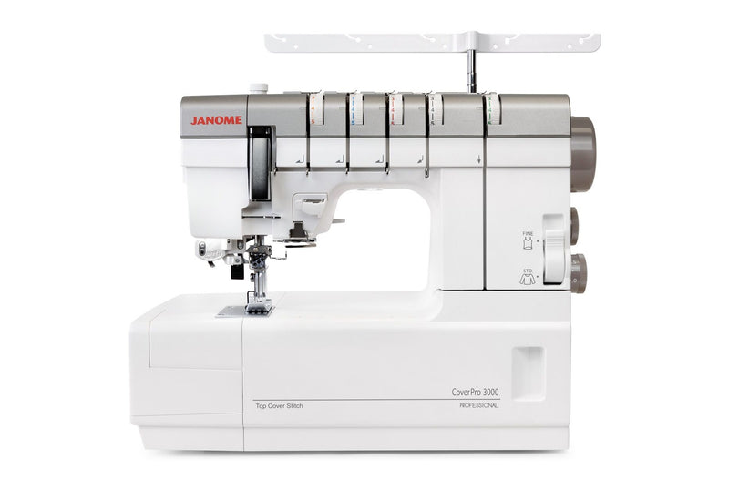 Janome CoverPro 3000P professional cover hem machine front view showing the extra long bed and thread cones.