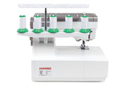 Janome CoverPro 3000P professional cover hem machine front view showing the extra long bed and thread cones.